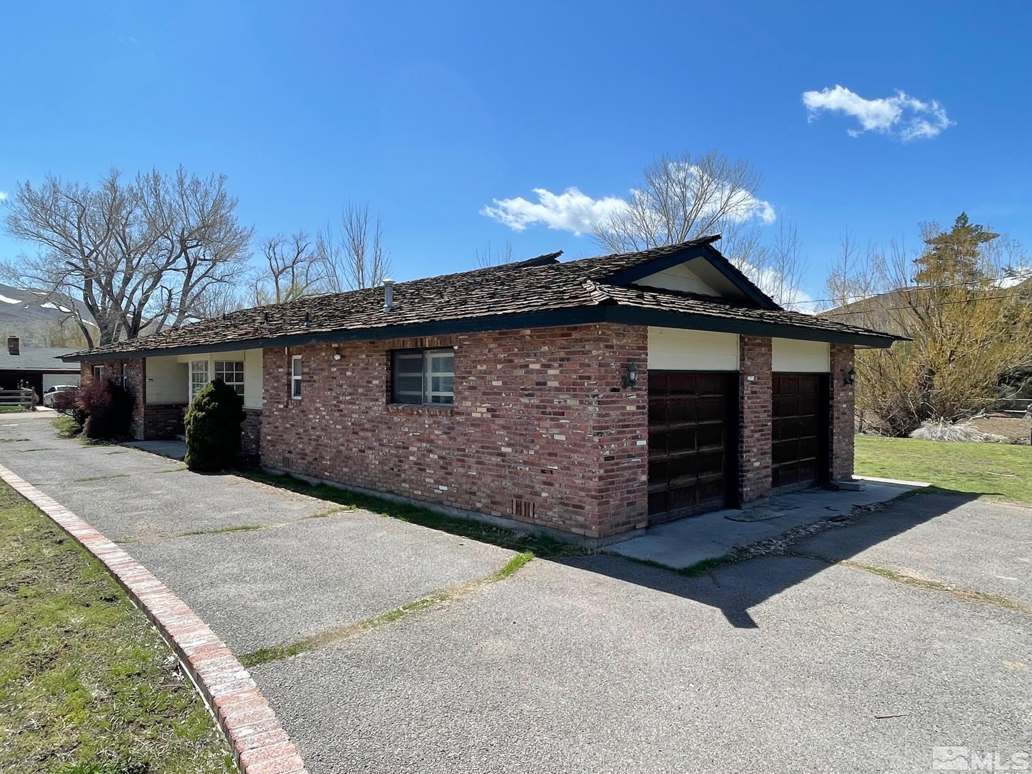 155 Cedar Lane Reno, NV 89521 - Photo 6 of 30 a front view of a house with a yard