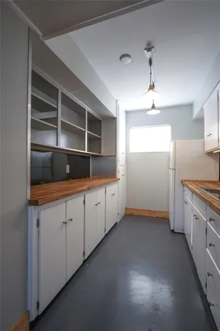 a kitchen with cabinets and window