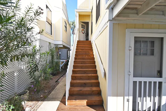 a bathroom with a sink a toilet a mirror and window