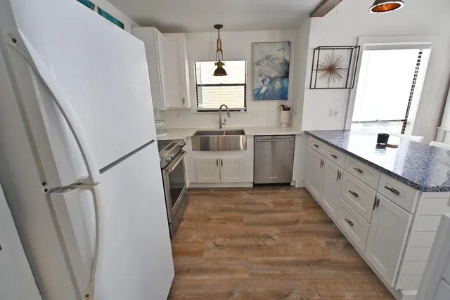 a living room with granite countertop furniture and a fireplace