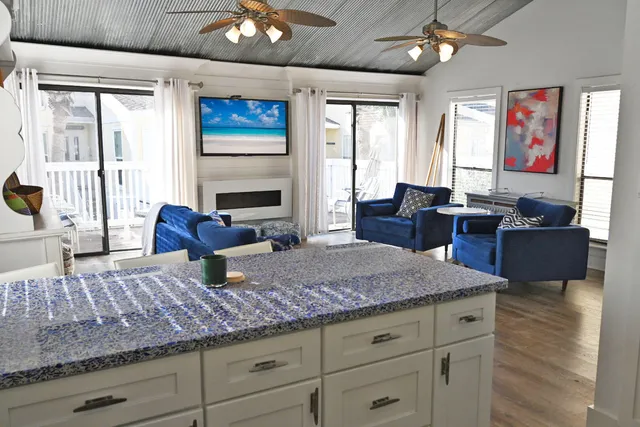 a living room with furniture fireplace and a flat screen tv