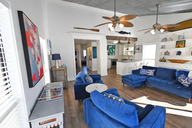 a view of a chair and tables in the balcony