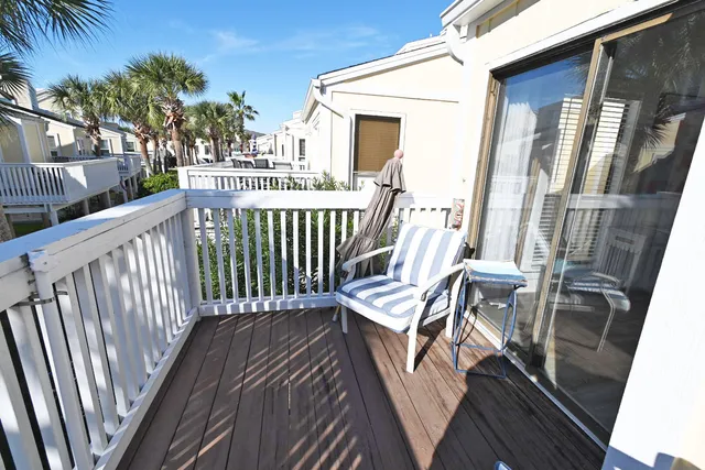 a view of a room with furniture wooden floor and window