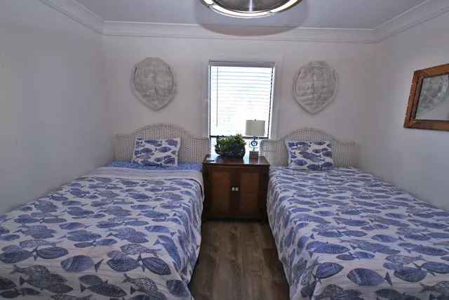 a bedroom with a bed and dresser