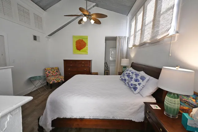 a bedroom with a bed and window