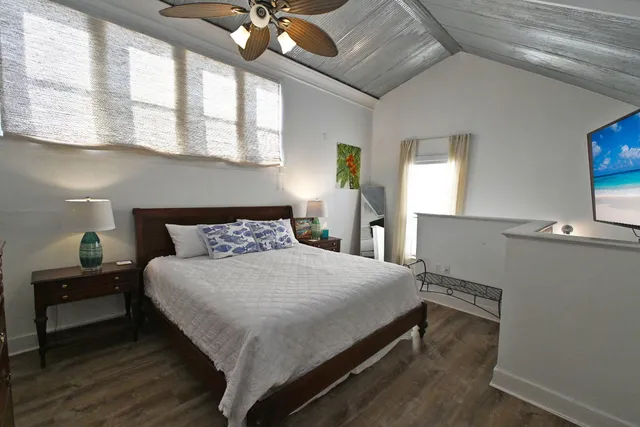 a bathroom with a toilet and a shower curtain