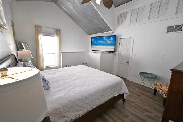 a bathroom with a toilet a sink and a mirror