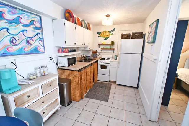 a bedroom with a large bed and a couch