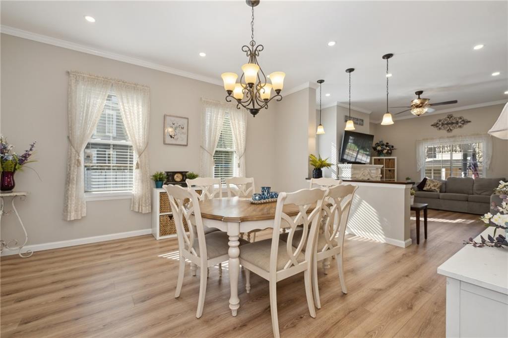 134 Monitor Avenue Pittsburgh, PA 15202 - Photo 11 of 50 a view of a dining room and livingroom with furniture wooden floor a chandelier