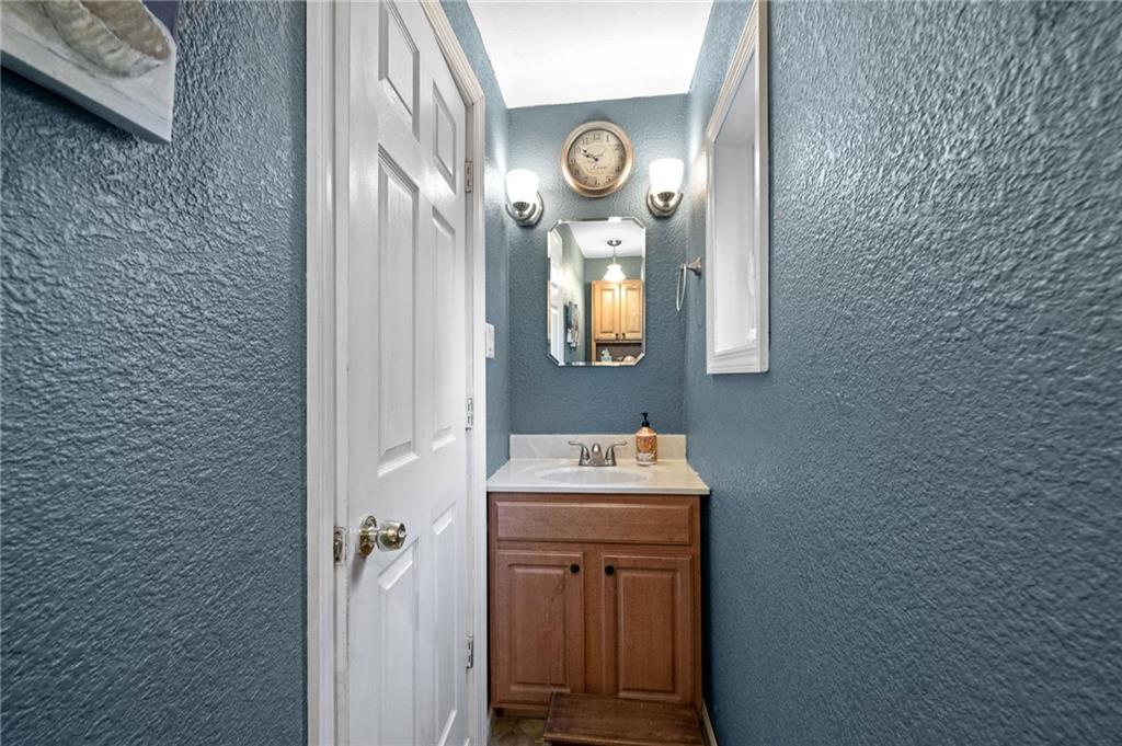 134 Monitor Avenue Pittsburgh, PA 15202 - Photo 17 of 50 a bathroom with a sink and a mirror