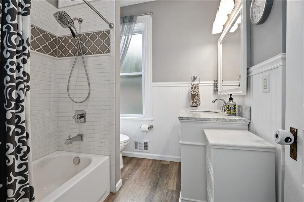 134 Monitor Avenue Pittsburgh, PA 15202 - Photo 21 of 50 a bathroom with a granite countertop sink a toilet and shower