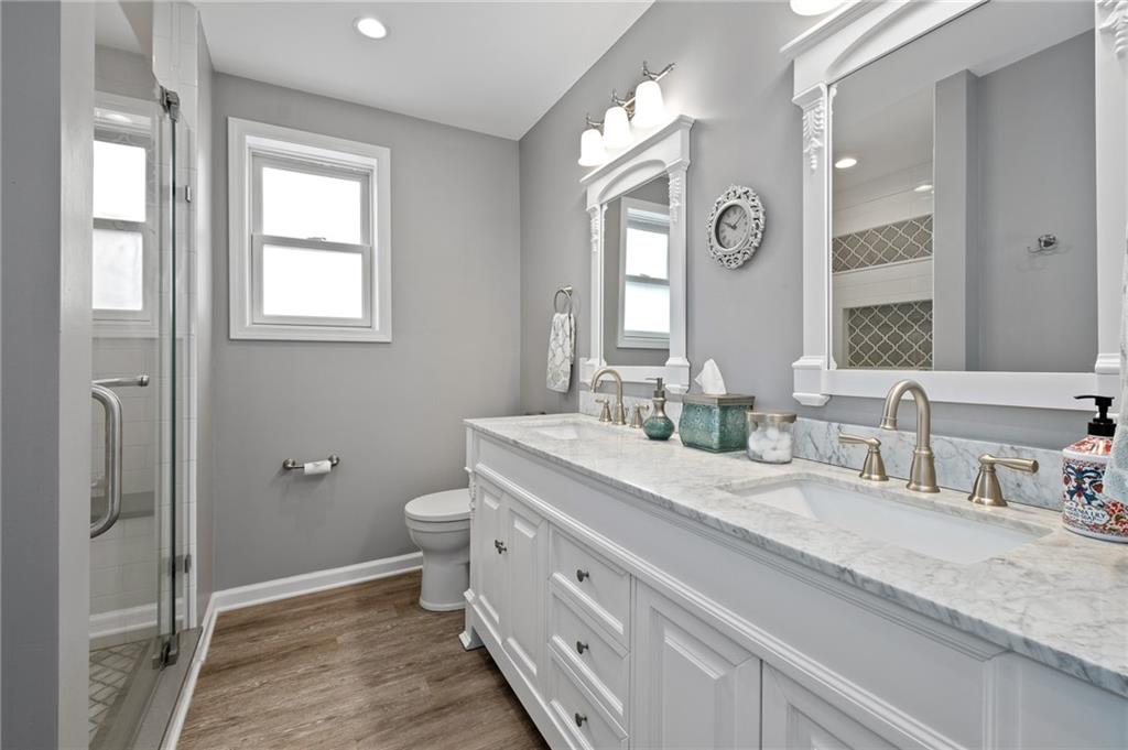 134 Monitor Avenue Pittsburgh, PA 15202 - Photo 29 of 50 a bathroom with double vanity and a mirror