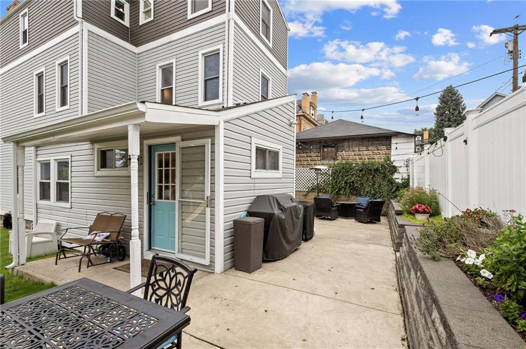 134 Monitor Avenue Pittsburgh, PA 15202 - Photo 40 of 50 a view of a patio with couches table and chairs and potted plants