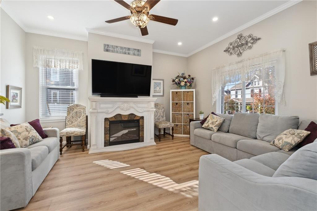 134 Monitor Avenue Pittsburgh, PA 15202 - Photo 8 of 50 a living room with furniture a fireplace and a flat screen tv