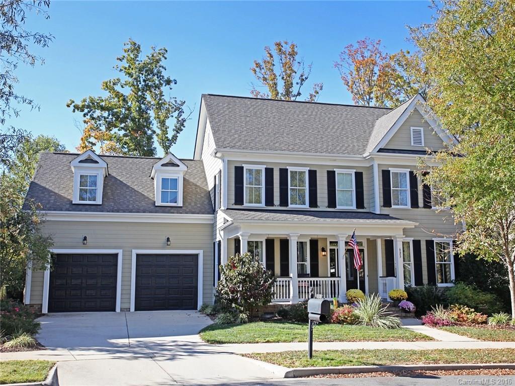 623 Revival Row Fort Mill, SC 29708 - Photo 1 of 24 a front view of a house with garden