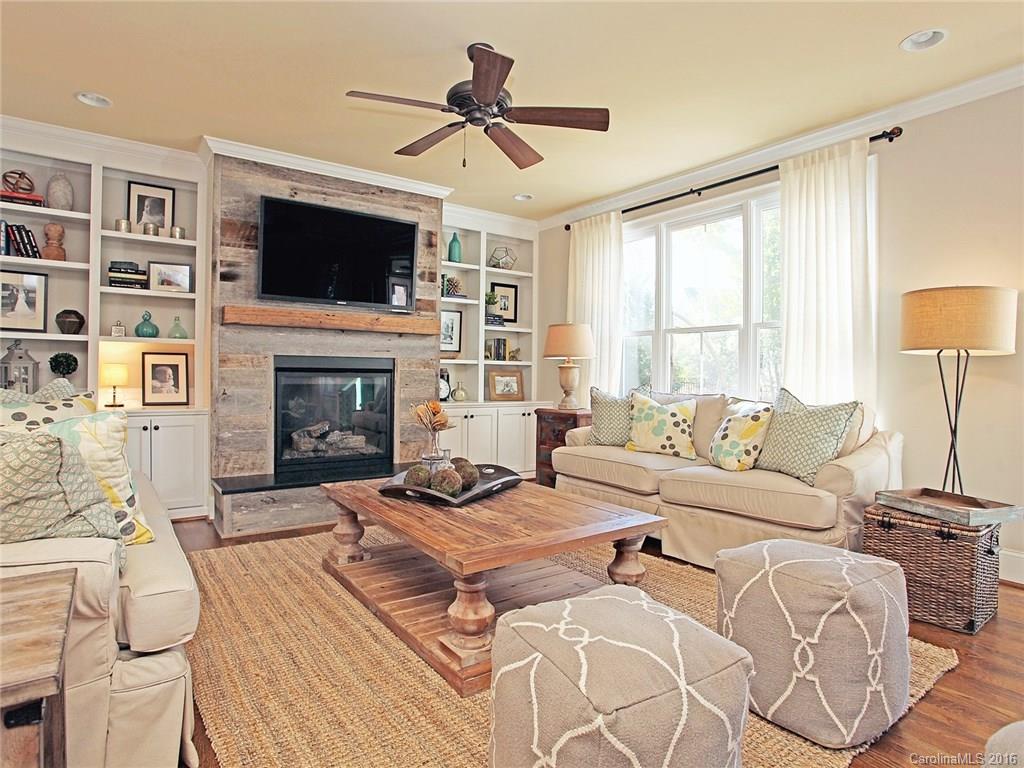 623 Revival Row Fort Mill, SC 29708 - Photo 12 of 24 a living room with furniture a fireplace and a flat screen tv