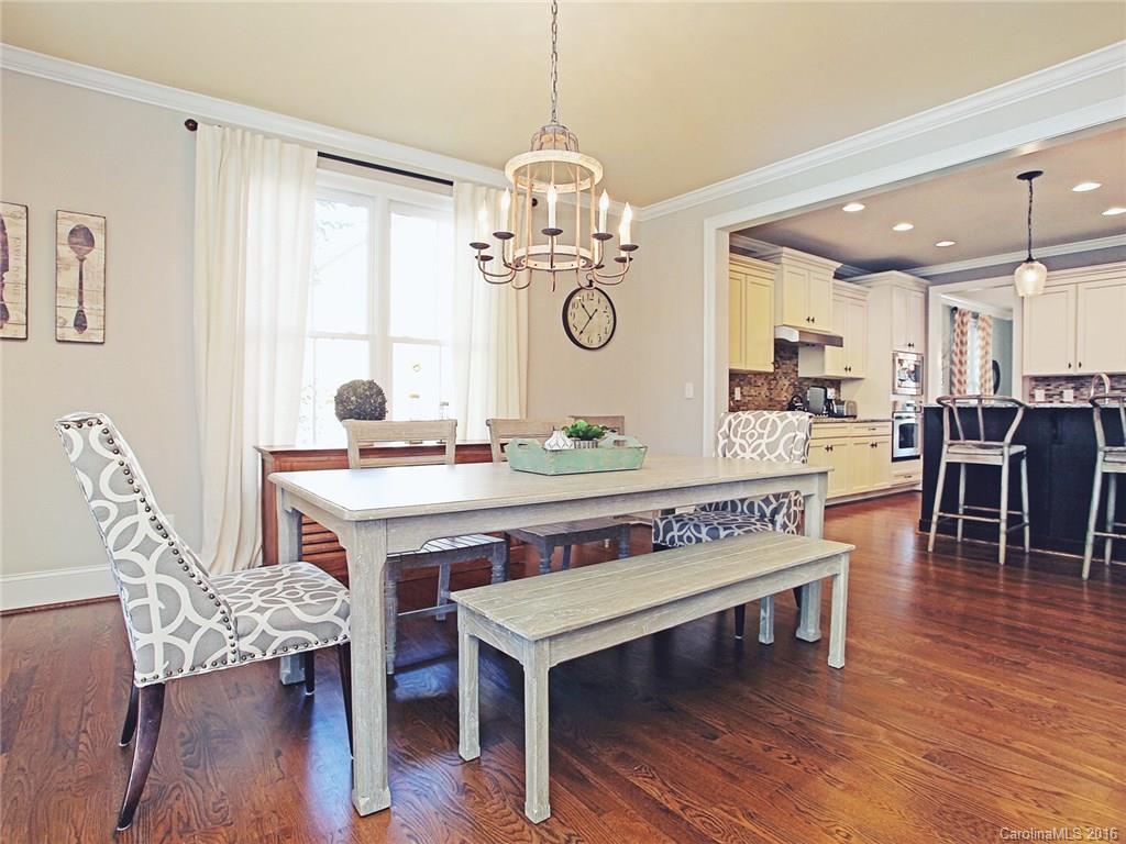 623 Revival Row Fort Mill, SC 29708 - Photo 14 of 24 a view of a dining room with furniture window and wooden floor