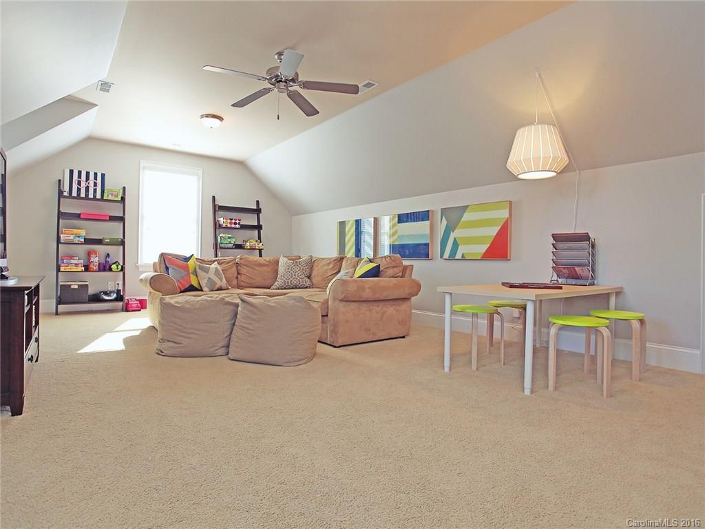 623 Revival Row Fort Mill, SC 29708 - Photo 16 of 24 a living room with furniture and a chandelier