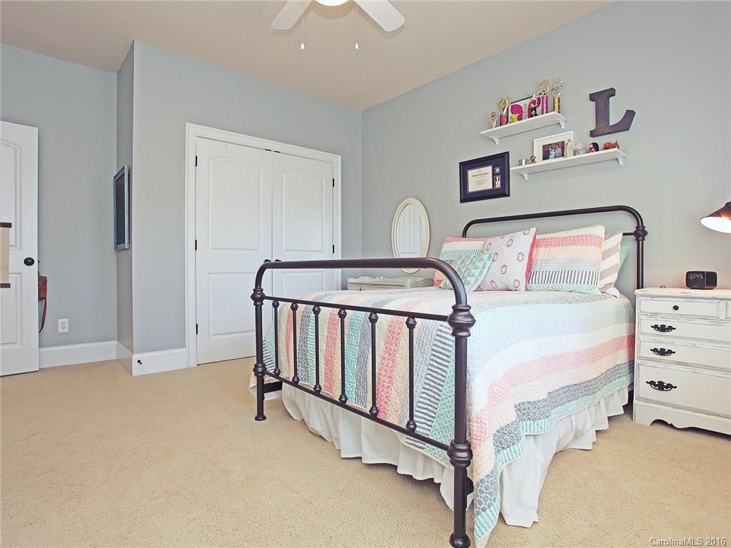 623 Revival Row Fort Mill, SC 29708 - Photo 21 of 24 a bedroom with a bed and a cabinets