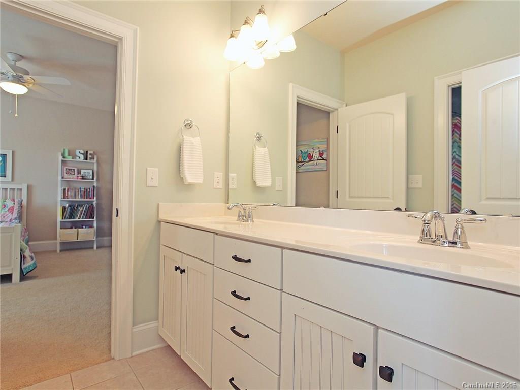 623 Revival Row Fort Mill, SC 29708 - Photo 22 of 24 a bathroom with a sink vanity and a mirror