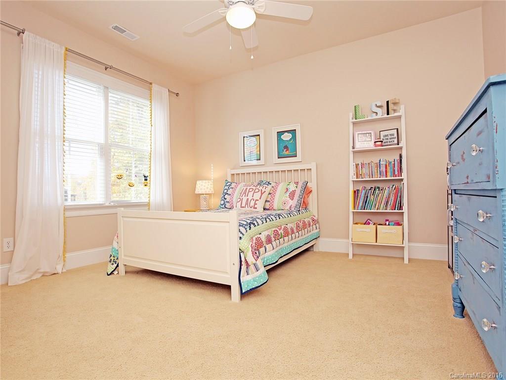 623 Revival Row Fort Mill, SC 29708 - Photo 23 of 24 a bed room with a bed and a chair