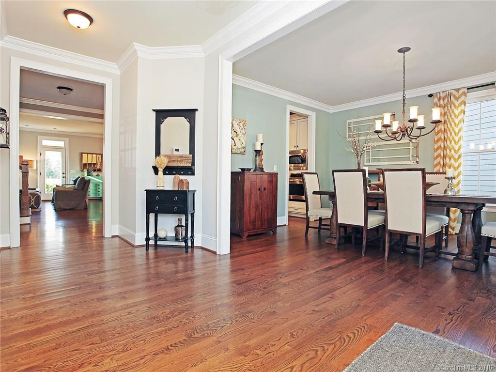 623 Revival Row Fort Mill, SC 29708 - Photo 5 of 24 a view of a dining room with furniture and wooden floor
