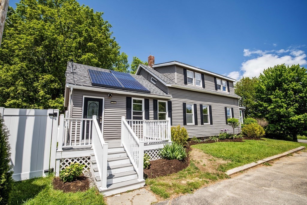 50 Newfields Road, Unit D Exeter, NH 03833 - Photo 2 of 36 a front view of a house with a garden