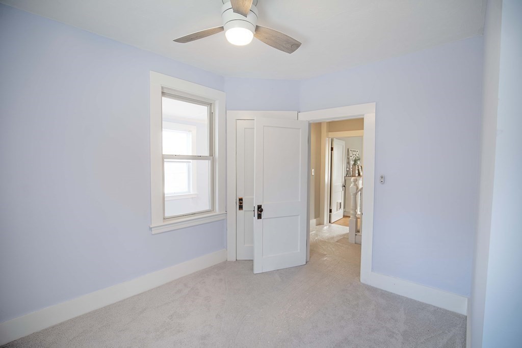 50 Newfields Road, Unit D Exeter, NH 03833 - Photo 23 of 36 an empty room with windows and closet area