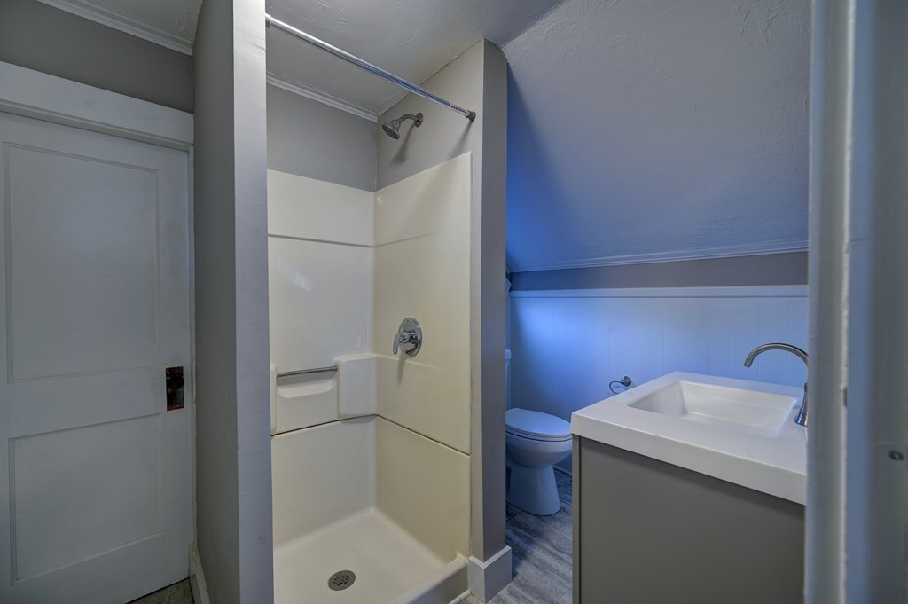 50 Newfields Road, Unit D Exeter, NH 03833 - Photo 34 of 36 a bathroom with a sink and mirror