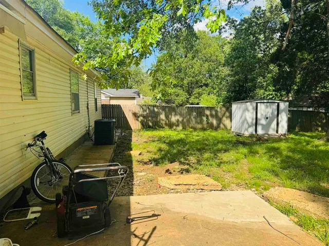 a view of yard with patio