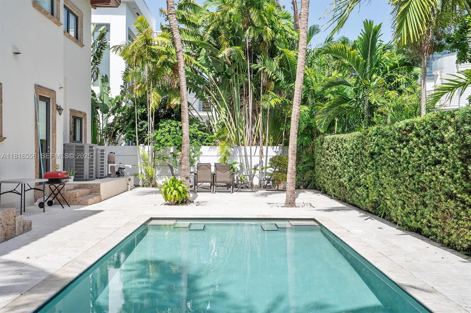 18825 North Bay Road Sunny Isles Beach, FL 33160 - Photo 11 of 62 swimming pool view with a seating space