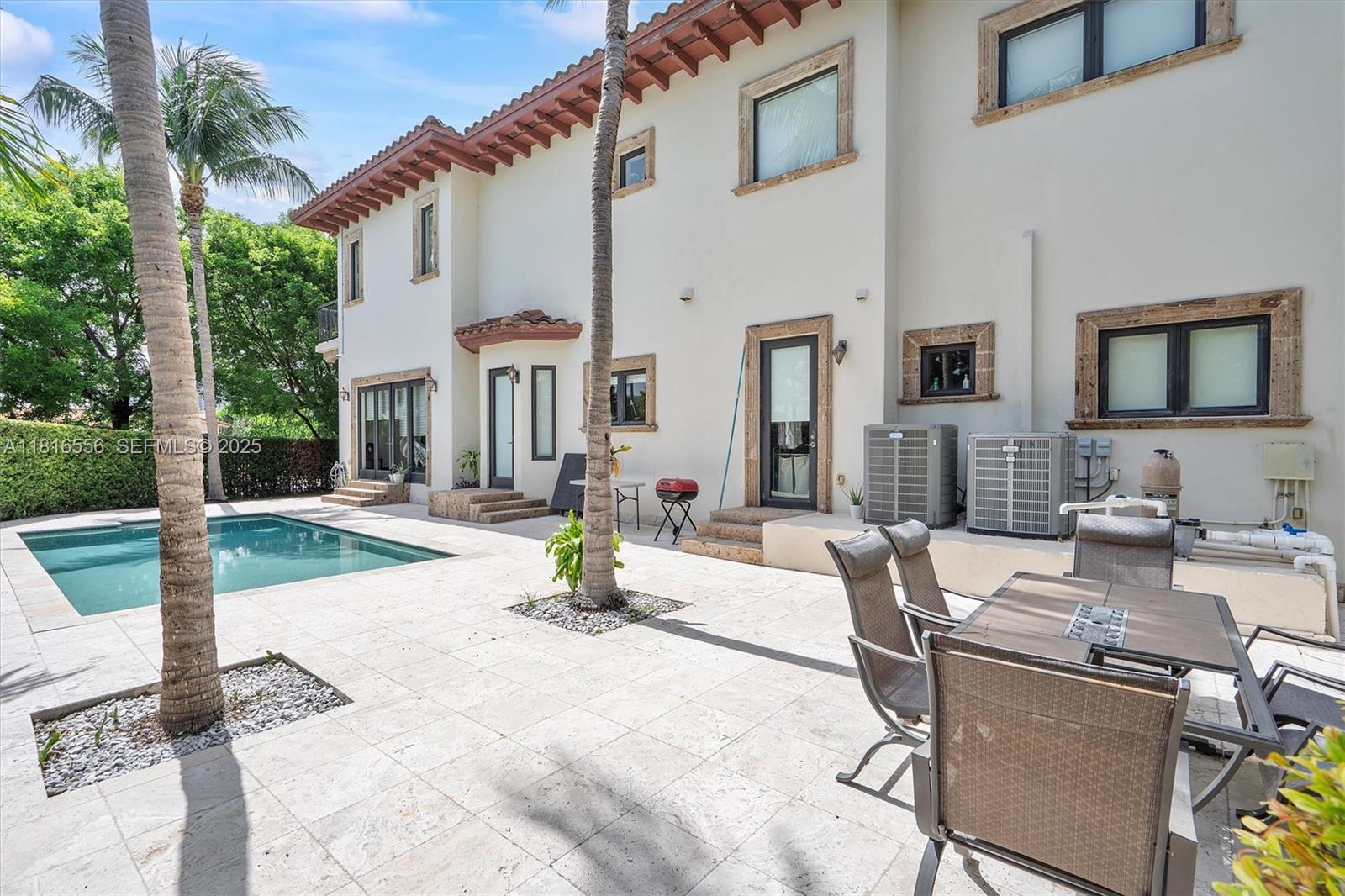 18825 North Bay Road Sunny Isles Beach, FL 33160 - Photo 14 of 62 a view of a patio with couches table and chairs