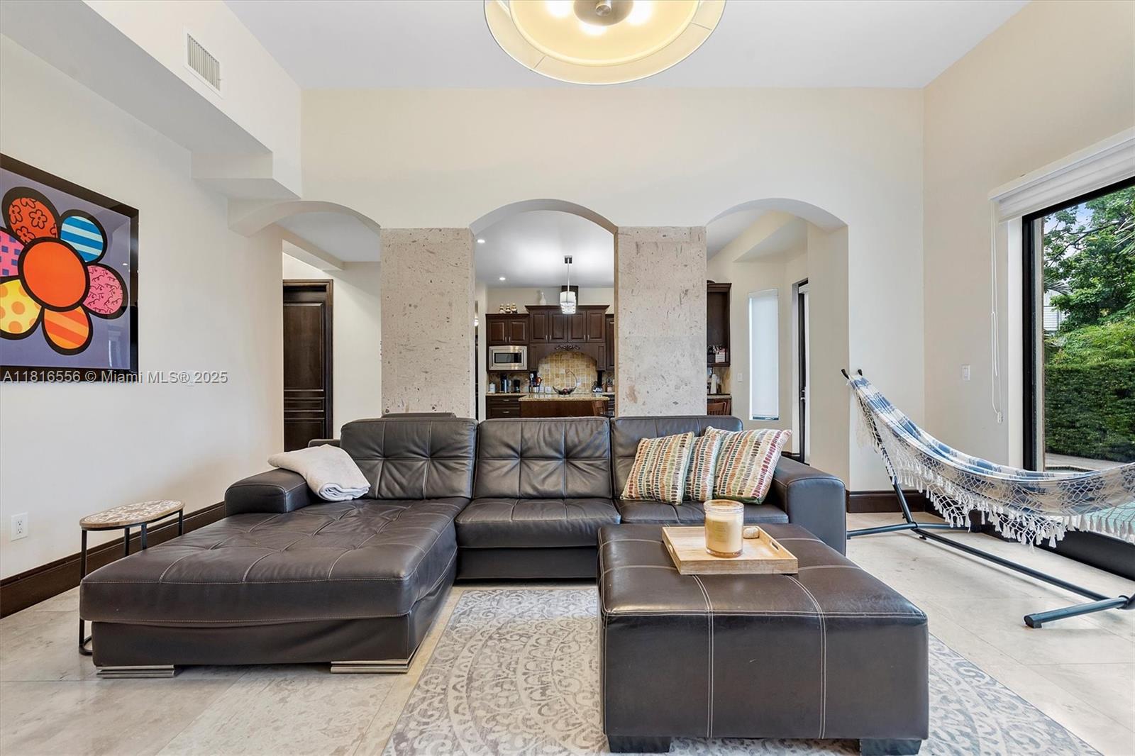 18825 North Bay Road Sunny Isles Beach, FL 33160 - Photo 20 of 62 a living room with furniture and a large mirror