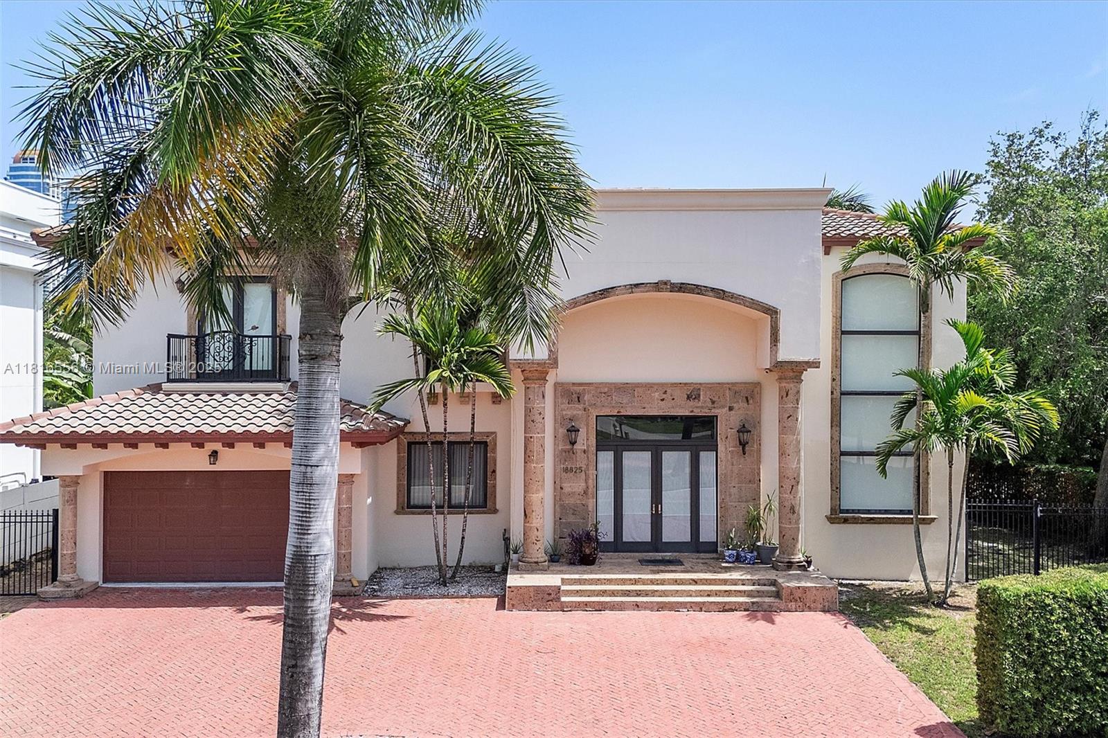 18825 North Bay Road Sunny Isles Beach, FL 33160 - Photo 2 of 62 a building with palm tree in front of it