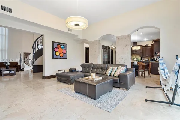 a dining room with furniture and window