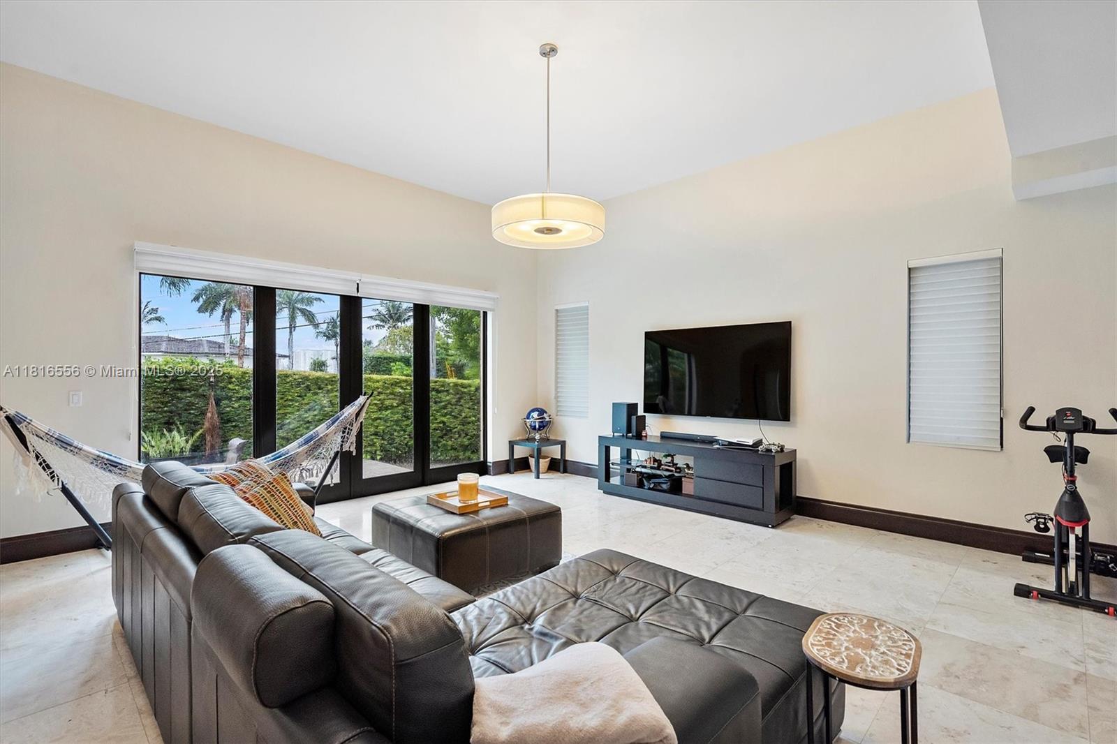 18825 North Bay Road Sunny Isles Beach, FL 33160 - Photo 23 of 62 a living room with furniture and a flat screen tv