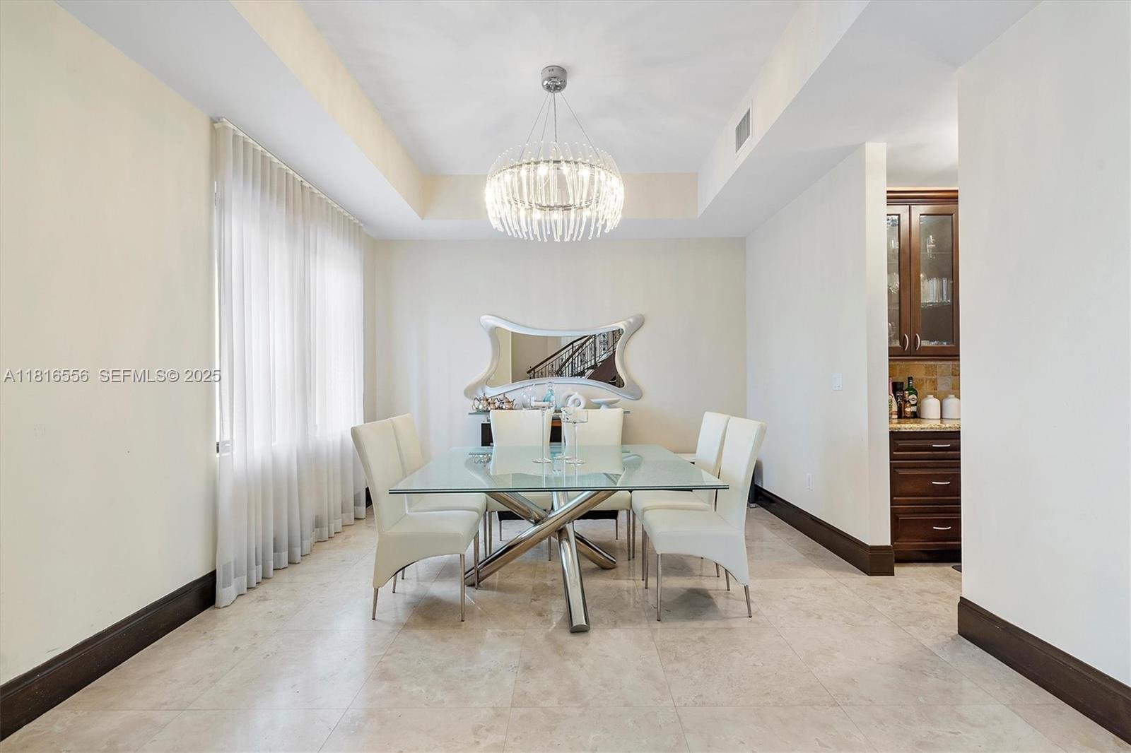 18825 North Bay Road Sunny Isles Beach, FL 33160 - Photo 24 of 62 a view of a dining room with furniture