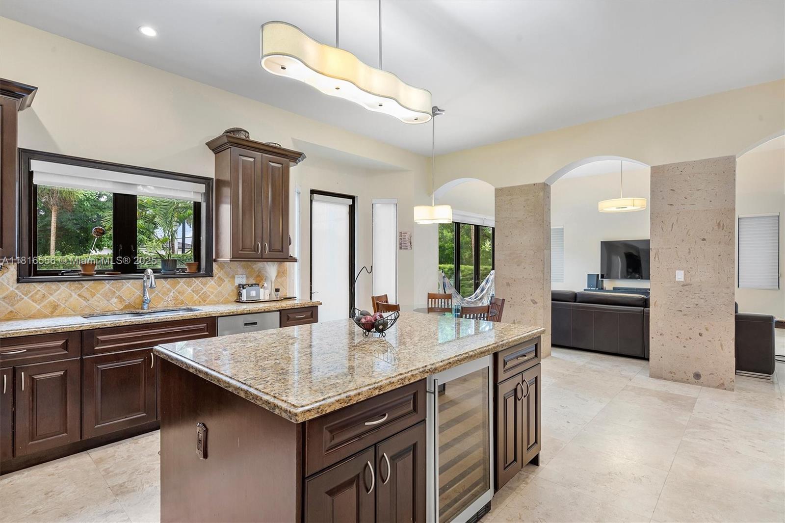 18825 North Bay Road Sunny Isles Beach, FL 33160 - Photo 30 of 62 a kitchen with a stove a sink and a refrigerator