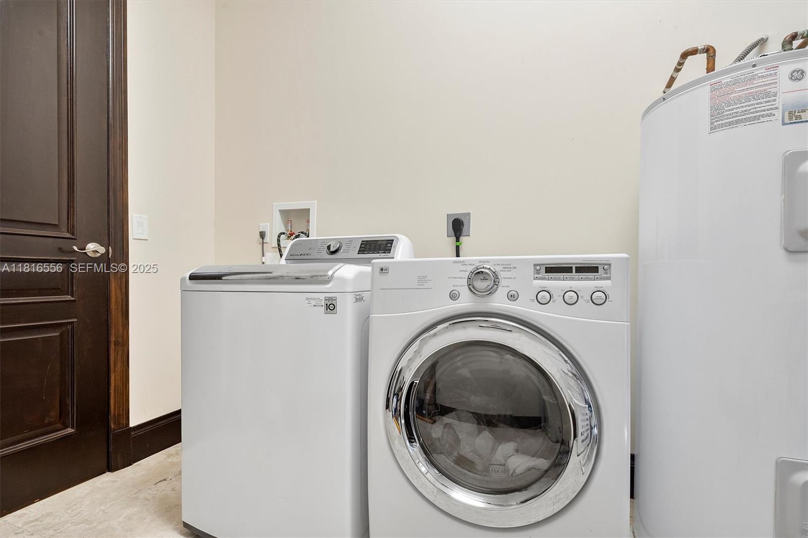 18825 North Bay Road Sunny Isles Beach, FL 33160 - Photo 33 of 62 a utility room with dryer and washer