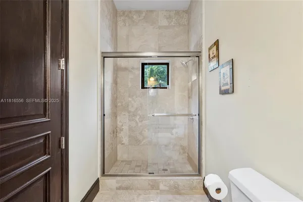 a spacious bathroom with a tub sink and mirror