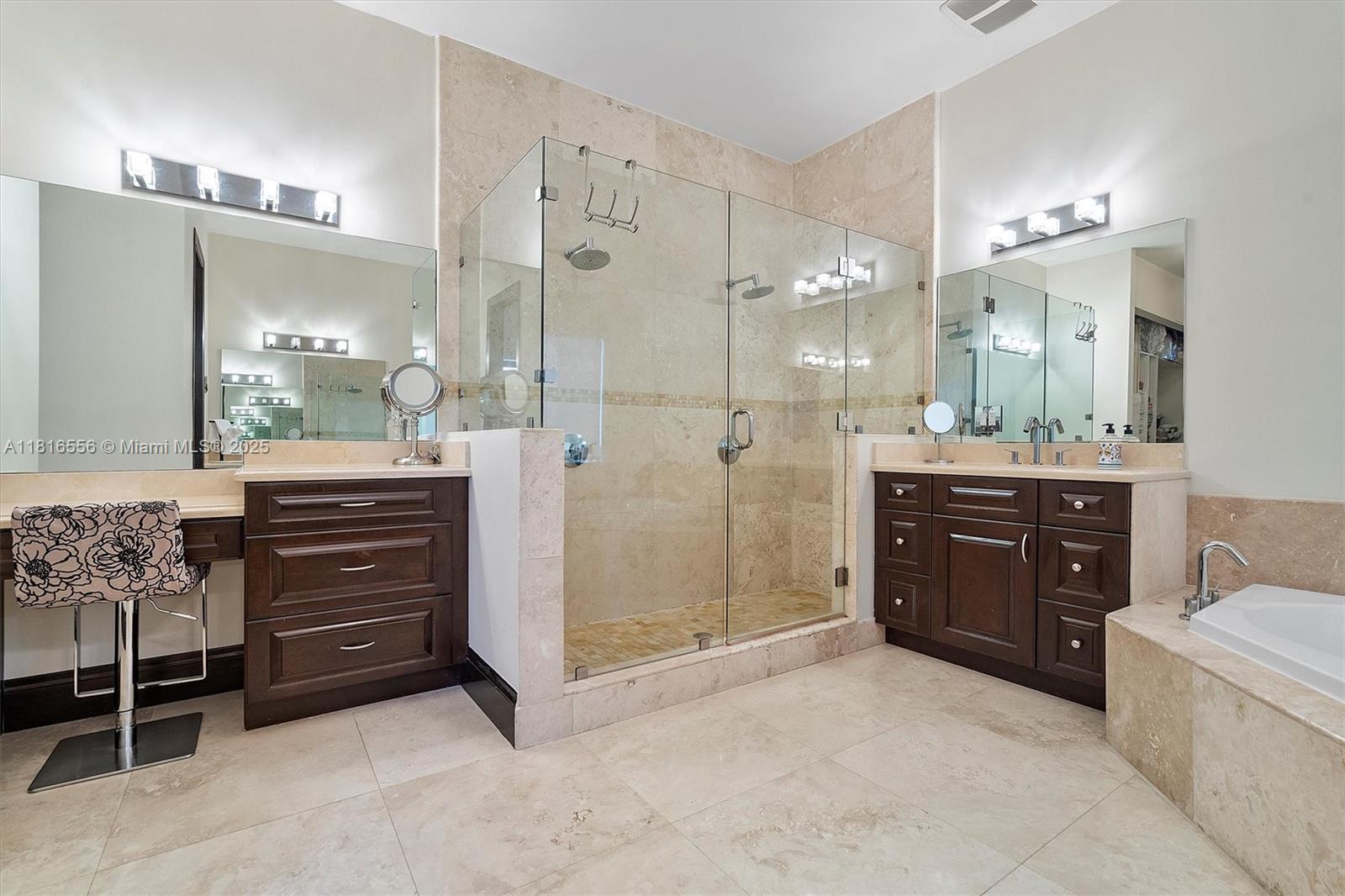 18825 North Bay Road Sunny Isles Beach, FL 33160 - Photo 43 of 62 a bathroom with a sink a vanity a mirror and a shower