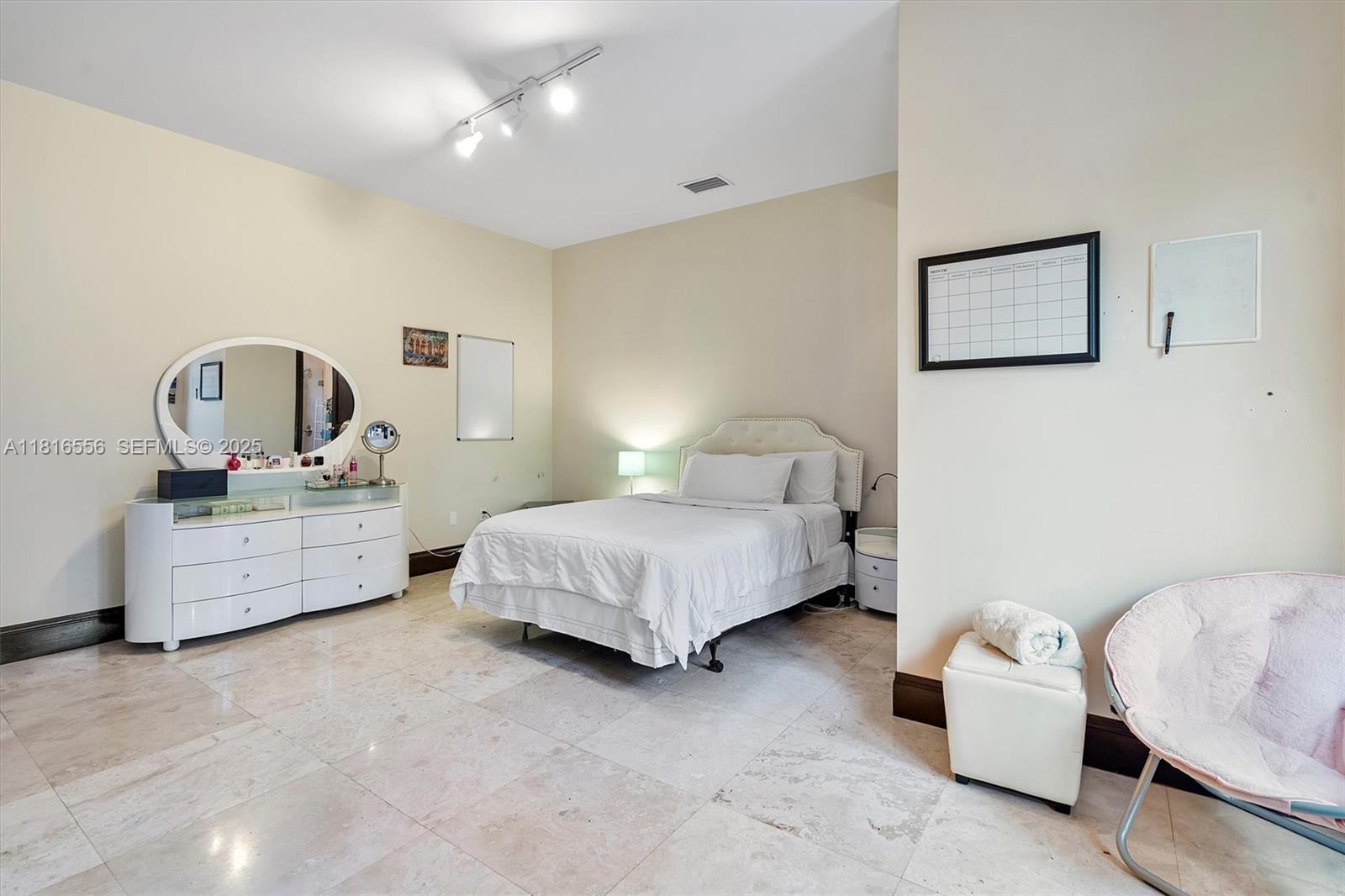 18825 North Bay Road Sunny Isles Beach, FL 33160 - Photo 50 of 62 a bedroom with a bed wooden floor and window