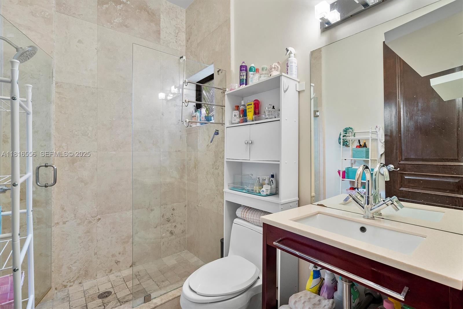 18825 North Bay Road Sunny Isles Beach, FL 33160 - Photo 53 of 62 a bathroom with a sink toilet vanity and shower