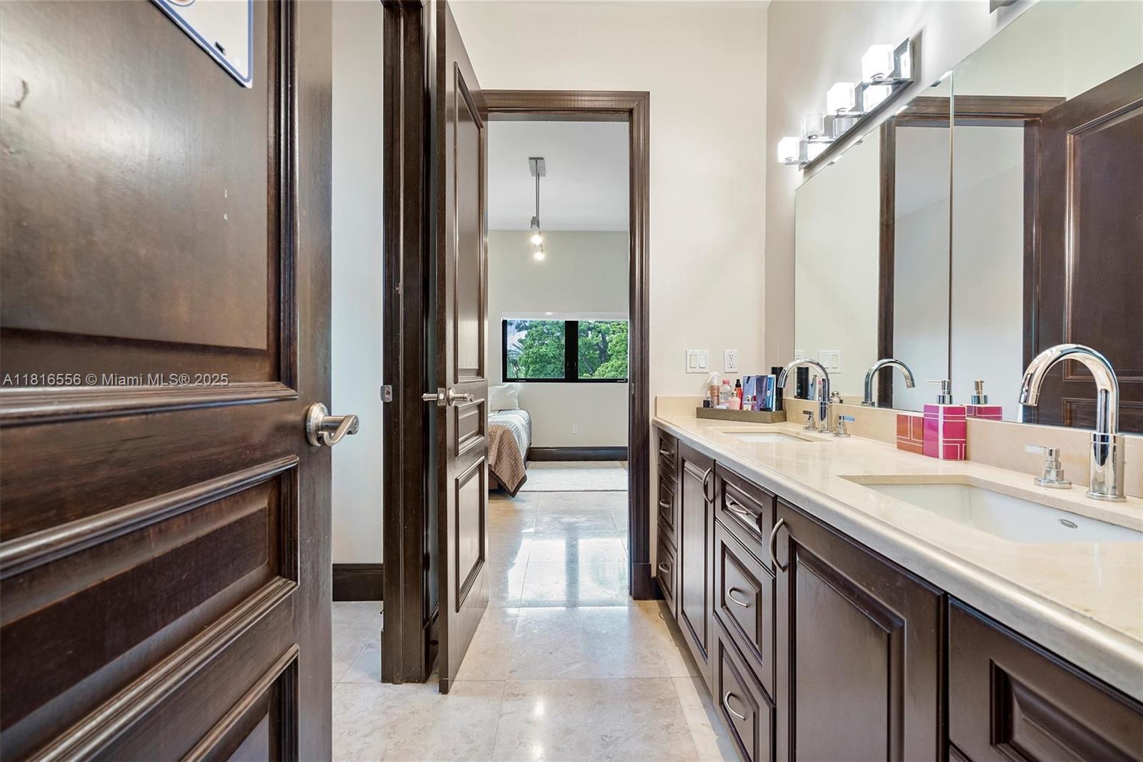 18825 North Bay Road Sunny Isles Beach, FL 33160 - Photo 59 of 62 a kitchen with a sink stove and refrigerator