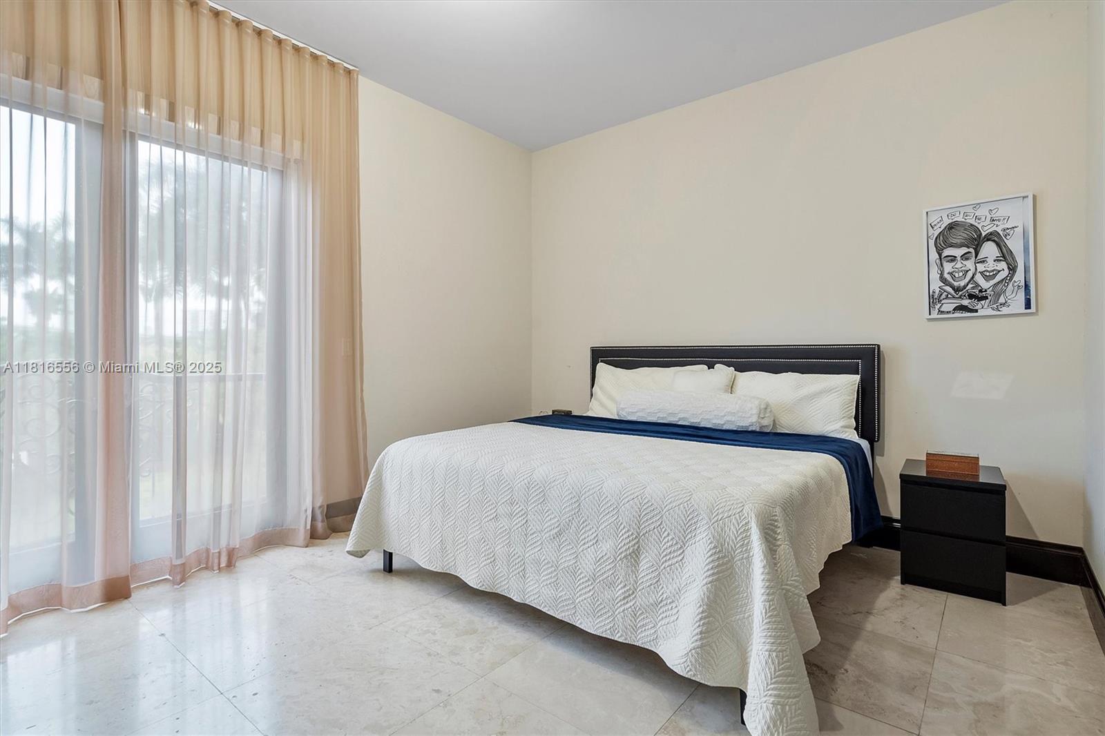 18825 North Bay Road Sunny Isles Beach, FL 33160 - Photo 60 of 62 a bedroom with a bed and window