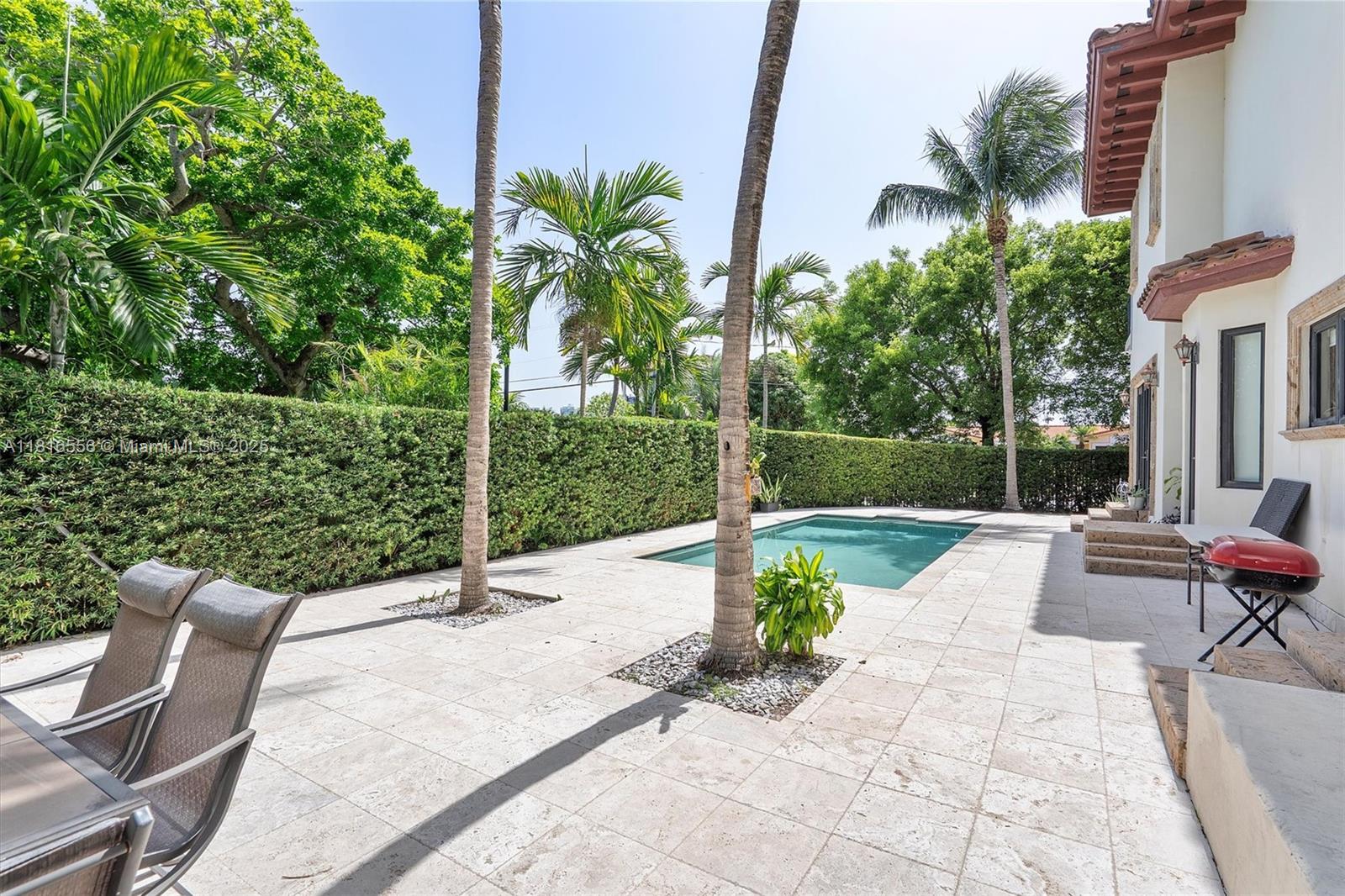 18825 North Bay Road Sunny Isles Beach, FL 33160 - Photo 9 of 62 a view of a backyard with sitting area and furniture