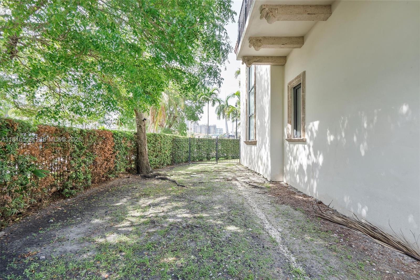 18825 North Bay Road Sunny Isles Beach, FL 33160 - Photo 10 of 62 a view of a small yard
