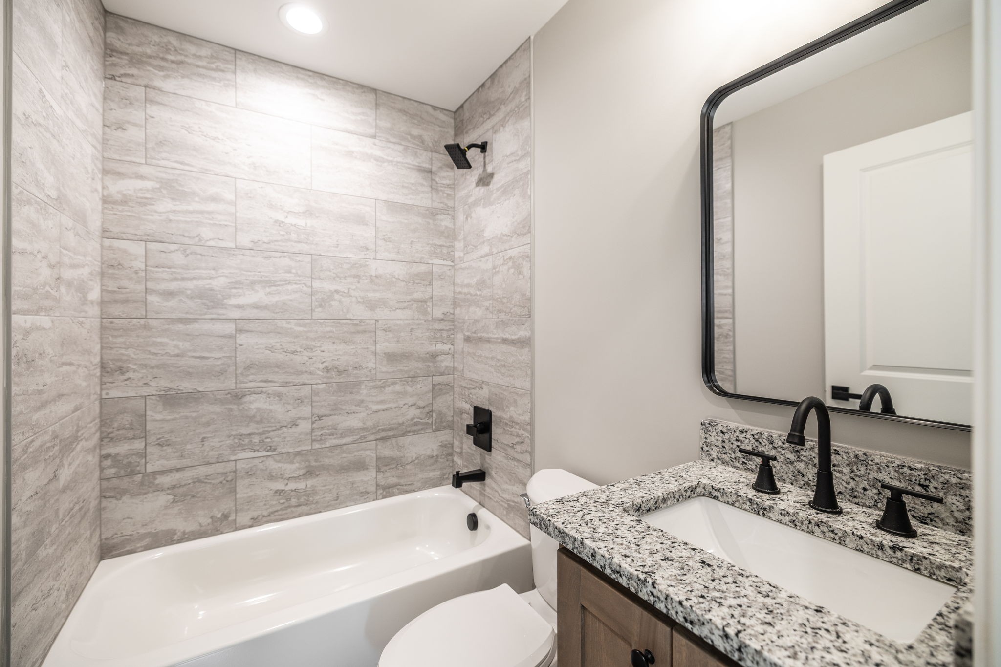 103 Portland Boulevard Portland, TN 37148 - Photo 56 of 100 a bathroom with a granite countertop bathtub sink vanity mirror and toilet