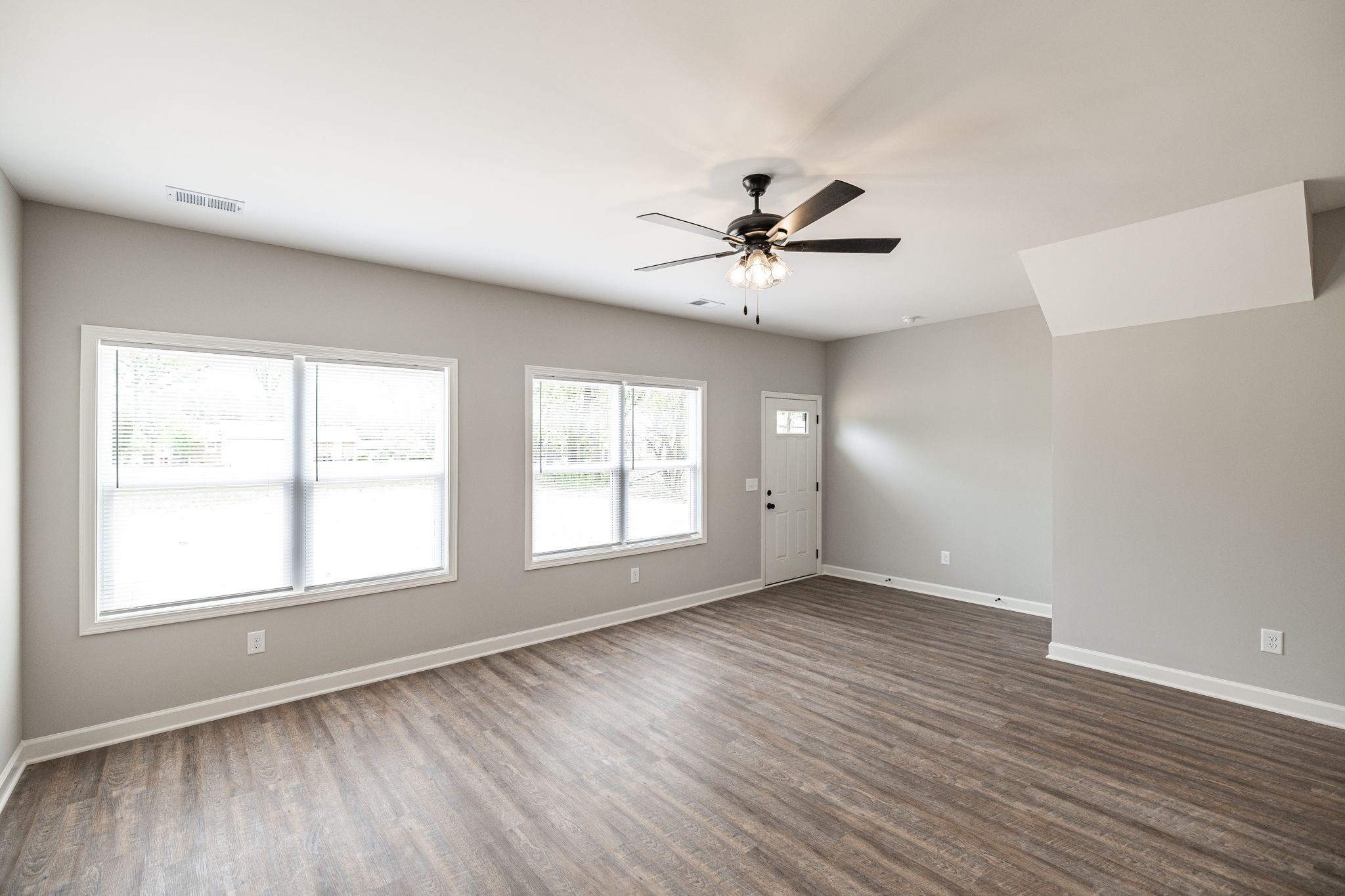 103 Portland Boulevard Portland, TN 37148 - Photo 79 of 100 a view of an empty room with a window and wooden floor
