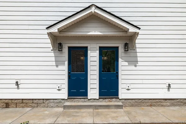 a view of a house with a yard and garage